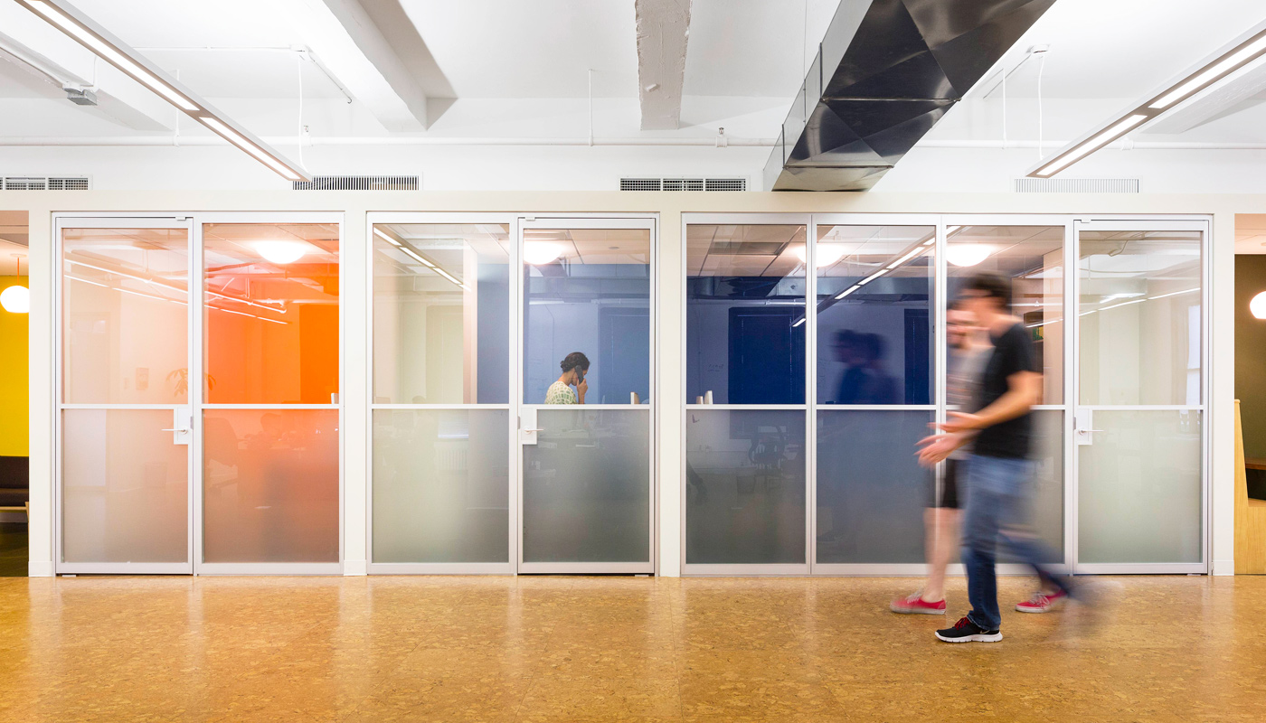 Harvest office: Swing doors and fixed panels helped designers with flexible space configurations while also maximizing light and transparency.